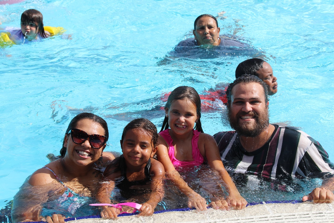 Local family enjoying a swim during the back to school pool party.